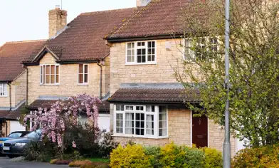 a house with trees and bushes