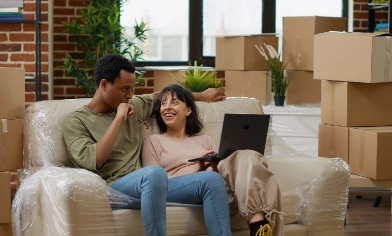 a couple having a discussion after moving in with boxes in the background