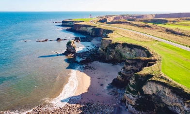 aerial view of cliffs overlooking the shoreline