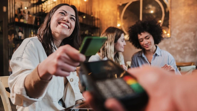 lady making a payment with her card