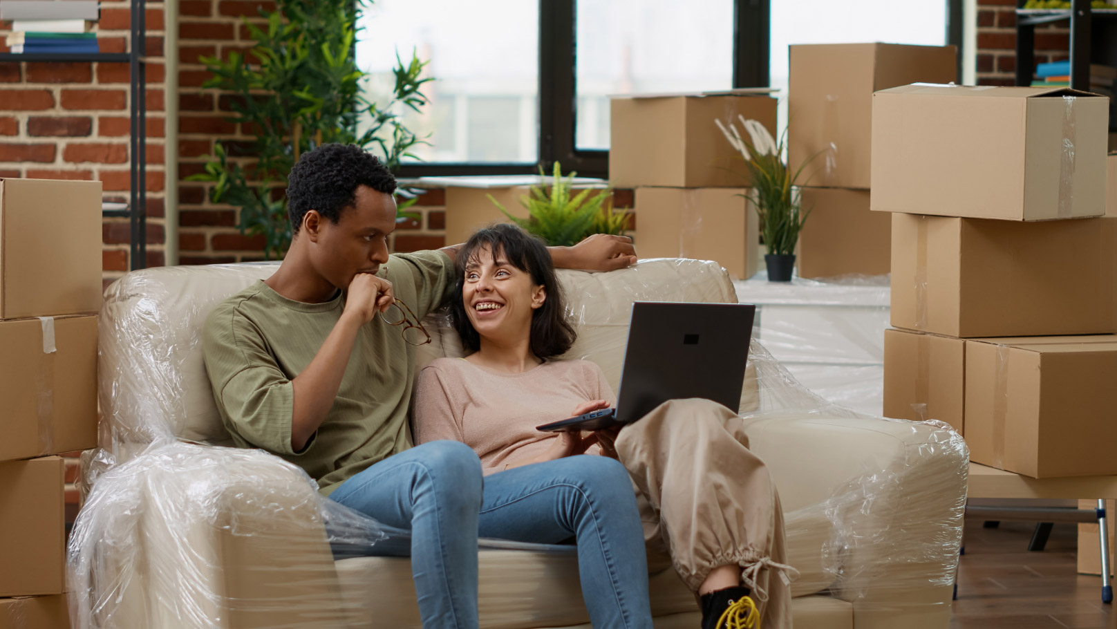 a couple having a discussion after moving in with boxes in the background